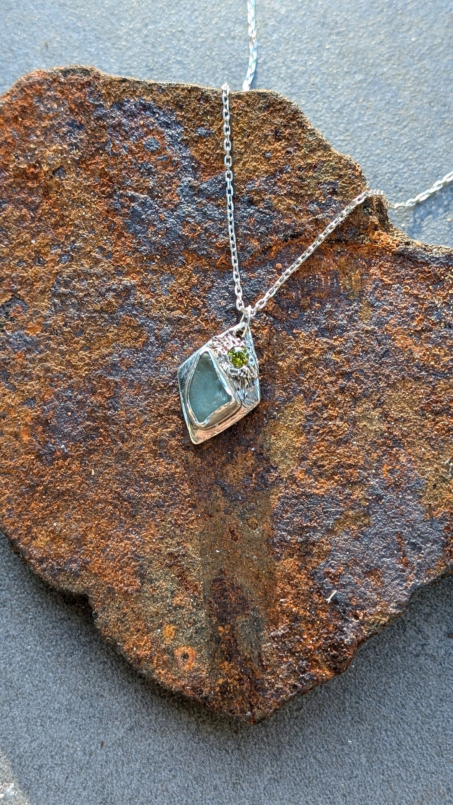 Handmade Diamond Shaped Teal Sea Glass with Green Cubic Zirconia pendant | 100% Recycled Sterling Silver | Eco-Friendly Coastal Jewellery.