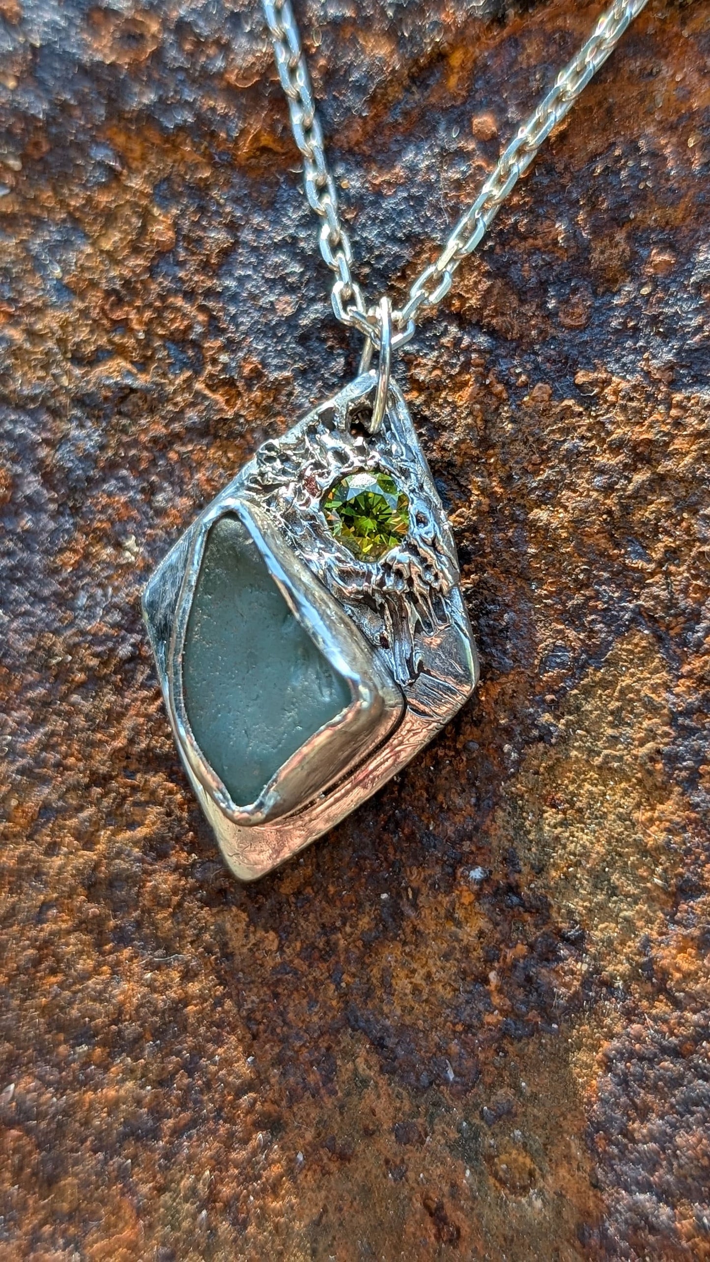 Handmade Diamond Shaped Teal Sea Glass with Green Cubic Zirconia pendant | 100% Recycled Sterling Silver | Eco-Friendly Coastal Jewellery.