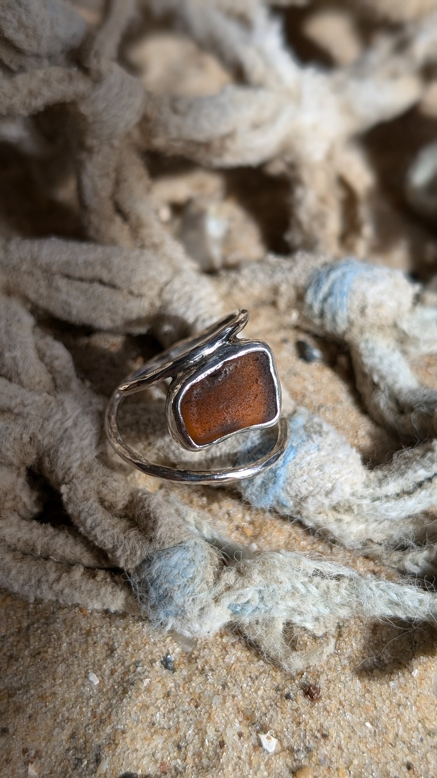 Adjustable brown sea glass ring with lightly hammered round band