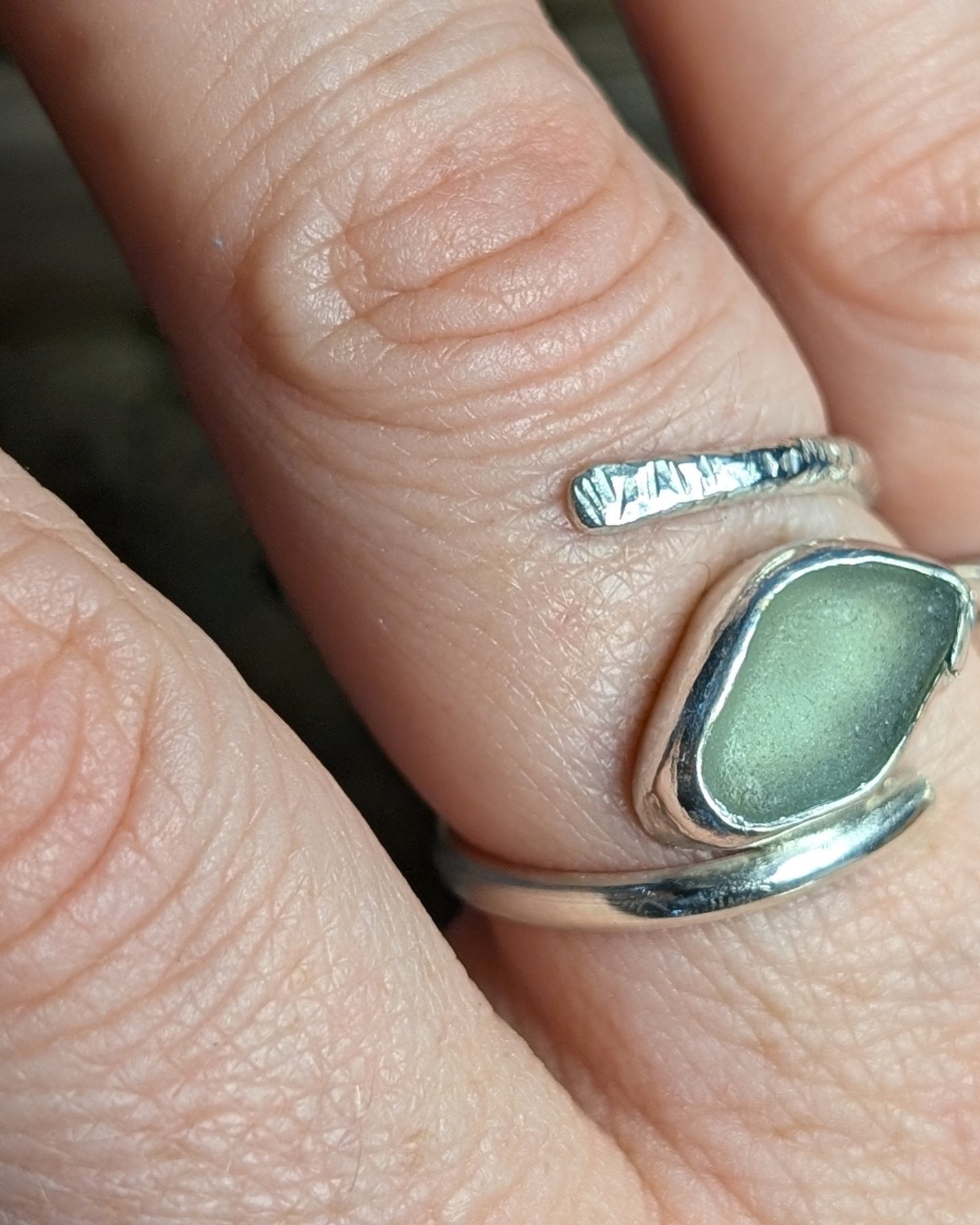 Adjustable sea foam sea glass ring with half hammered round band