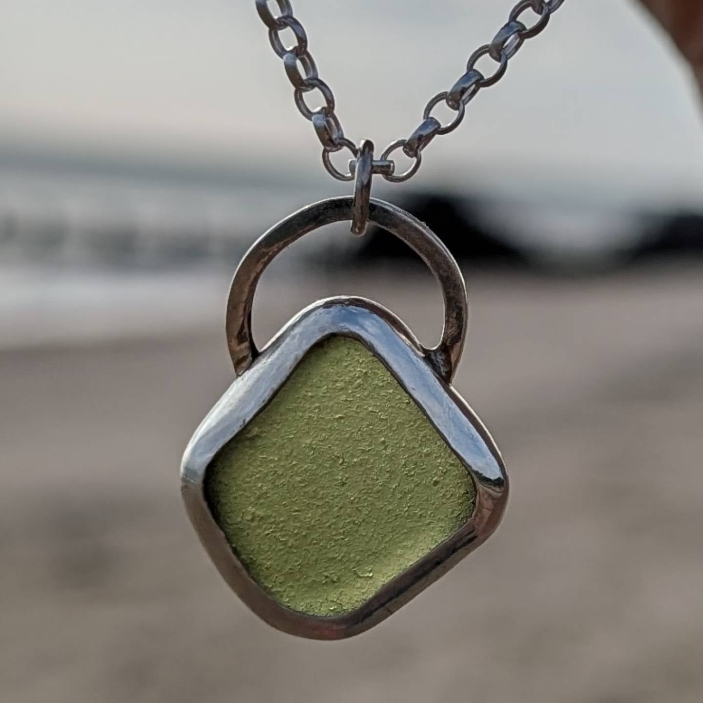 Green sea glass pendant encased in bezel with chunky Belcher chain
