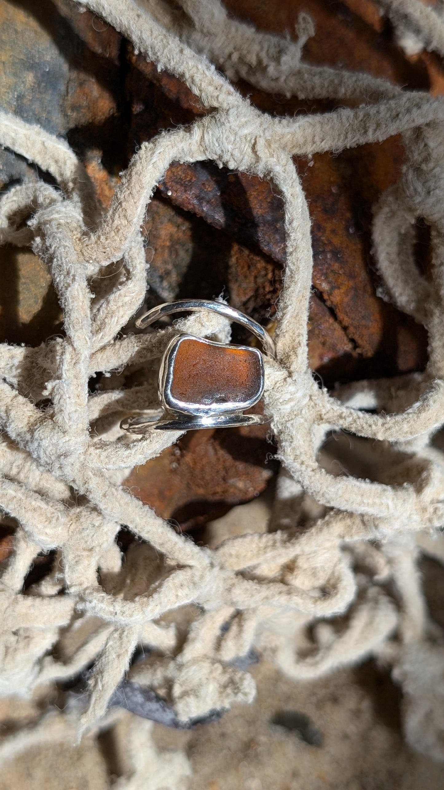 Adjustable brown sea glass ring with lightly hammered round band