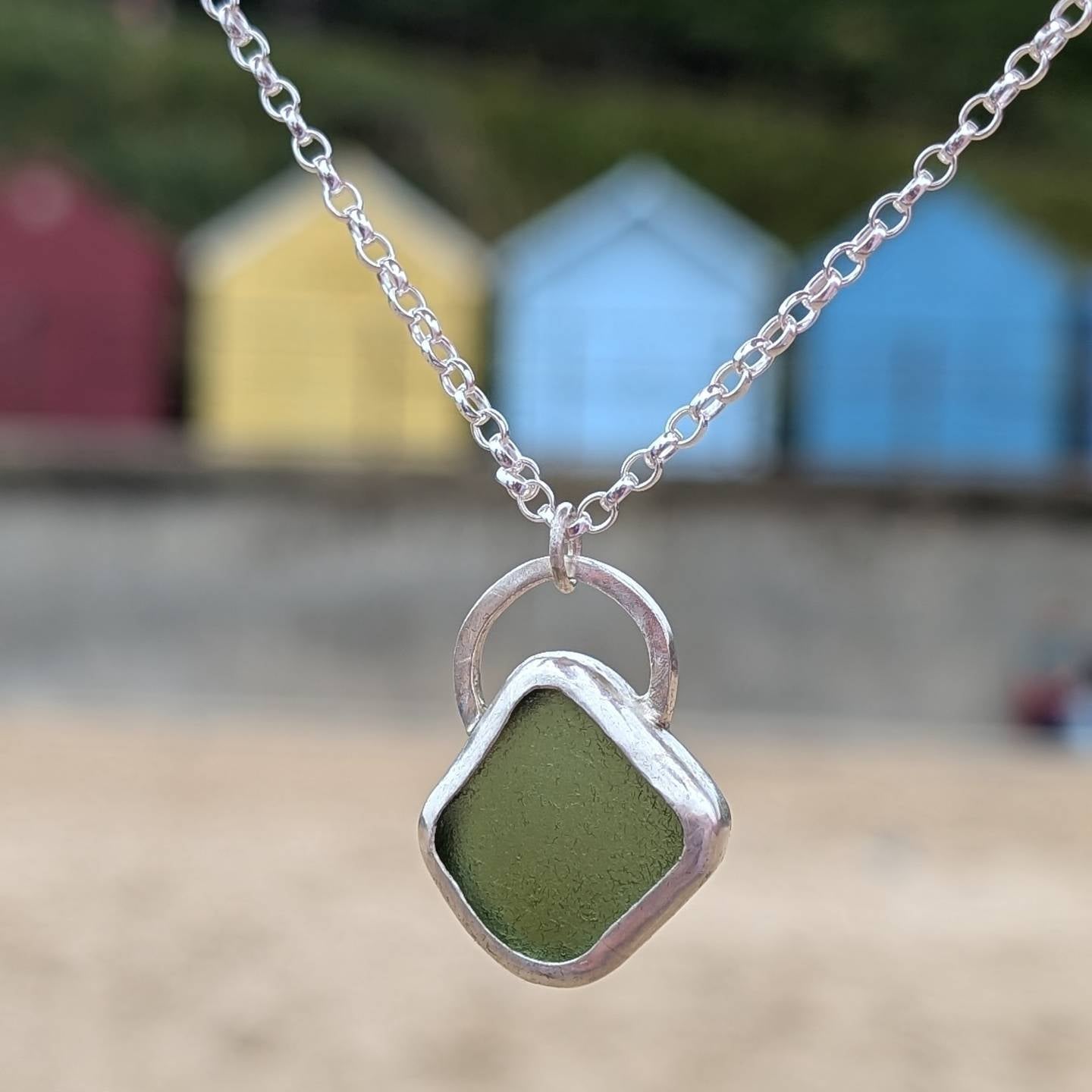 Green sea glass pendant encased in bezel with chunky Belcher chain