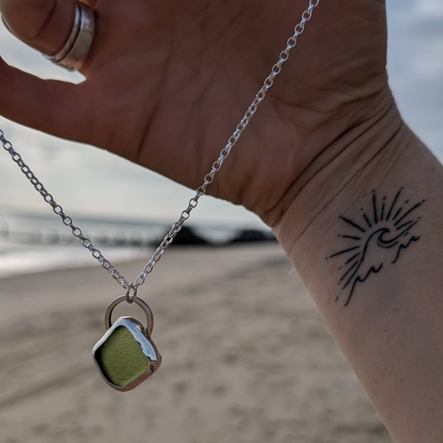 Green sea glass pendant encased in bezel with chunky Belcher chain